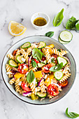 Vegeterian fusilli salad with vegetable and feta