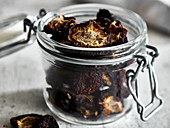 Plum chips: dried plums in a glass jar