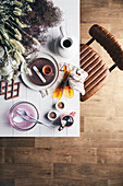 View of table with dishes and grass and chair with leather cover