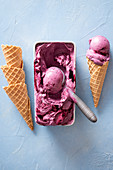 Homemade blueberry ice cream and waffle cones