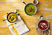 Beetroot soup, sweet potato soup with coriander sambal, herb soup