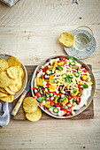 Loaded Mexican dip with nacho chips