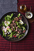 Seared kangaroo loin salad with horseradish and rocket