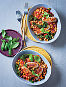 Tomato-braised sausages with chickpeas and kale