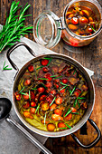 Tomato confit in a pan and a jar