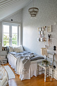 Single bed with valance below window in vintage-style bedroom