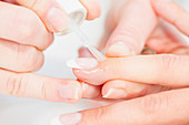 Woman having manicure