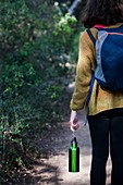 Woman walking on a forest path