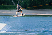 Wakeboarding performing stunt