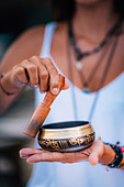 Woman with Tibetan singing bowl