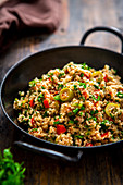 Israeli couscous salad with olives, tomatoes and parsley