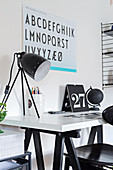 Poster of alphabet above desk decorated in black-and-white