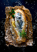 Gilthead in salt with herbs