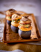 Savoury cream puffs with spinach and truffles