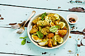 Roast young potato salad with egg and cucumber