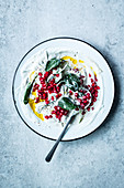 Tzatziki with spinach and pomegranate seeds