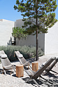 Deckchairs in gravel courtyard