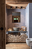 Mirrored washstand base cabinet decorated with log pieces