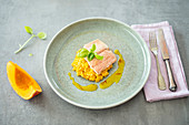 Pumpkin risotto with salmon trout and an orange and saffron sauce