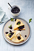 Crepes with blueberry compote and honey foam