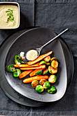Pan-fried Brussels sprouts and carrots with a Savoy cabbage sauce and capers