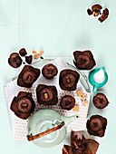 Chocolate muffins with fudge and tea