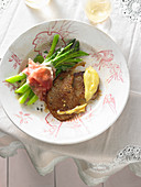 Veal escalope with green asparagus, parma ham and zabaglione