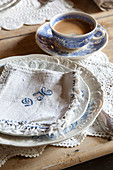 Breakfast table set with coffee and monogrammed napkin