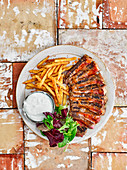 Buffalo-style steak and chips with blue cheese sauce