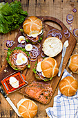 Lox with cream cheese, egg and red onions on a roll