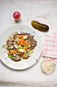 Prime boiled beef with vegetables and chive sour cream