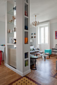 Vases on partition shelves built around radiator