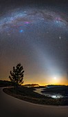 Milky Way and zodiacal light over countryside