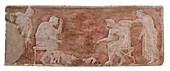 Painted bas relief of dog and cat fight.