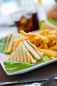 Club sandwich with French fries