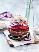 Healthy vegeterian bean burgers with sprouts and arugula