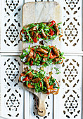Merguez tartines with roasted pepper and rocket
