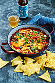 Queso fundido - melted cheese dip from Mexico with tortilla chips
