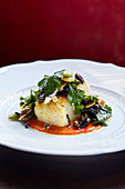 Roasted cod and romesco sauce with olive and almond dressing