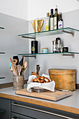 Glass shelves above kitchen worksurface