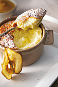 Pear soufflé with apricot sauce and pear chips
