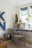 Sewing machine and old tins in vintage-style work room