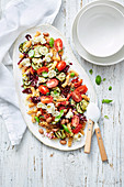 Fusilli with semi-dried tomato pesto, borlotti beans and zucchini, Italy