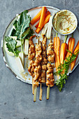 Chicken satay skewers with a curry dip