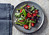 Asparagus salad with strawberries and feta cheese