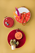 Embroidery rings covered with corduroy used as wall decorations or pinboards