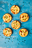 Mini cheese and bacon tarts with chives