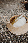 Bottle of Champagne and white cloth in basket