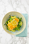 Avocado salad with spicy salmon fillet
