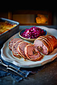 Stuffed saddle of venison with prunes and brioche